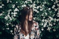 Sensual calm portrait of beautiful hipster woman in blooming bus