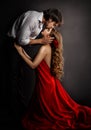 Sensual Couple Kissing in Love. Handsome Man hugging romantic Woman in red Dress. Valentines People Concept Royalty Free Stock Photo