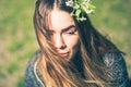 Sensual dreamy portrait of a spring woman, beautiful face female enjoying Cherry blossom, tree branch and natural beauty Royalty Free Stock Photo