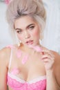 Sensual girl with blond hair in lingerie and accessories Royalty Free Stock Photo