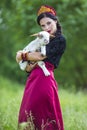 Sensual Glamour Model in Russian Style Kokoshnik Holding Newborn Lamb Cub Against Nature Background Royalty Free Stock Photo