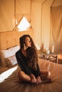 Sensual glamour portrait woman in interior of modern luxury glamping tent camp Royalty Free Stock Photo