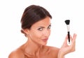 Sensual hispanic female with make up brush