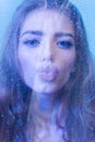 Sensual Kiss. Aqua treatment of pretty woman with long hair. Royalty Free Stock Photo