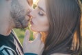 Sensual Kiss. Close-up of beautiful passionate couple kissing. Sexy couple In Love. Intimate relations. Mouths kissing