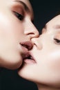 Sensual kiss of Couple Women with sugar on lips Royalty Free Stock Photo