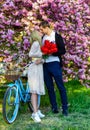Sensual Kiss. Sakura Tree Blooming. Girl And Man Retro Bicycle Sakura Tree. Couple In Love. Spring Holidays. Enjoying