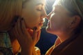 Sensual kiss of two beautiful lesbian girls close-up. Lesbian couple, gay marriage Concept