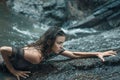 Sensual lady hiking on the wet rocks Royalty Free Stock Photo