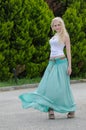 Sensual lady wears blue long skirt