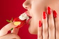 Sensual lips with strawberries and cream close-up Royalty Free Stock Photo