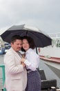 Sensual couple middle-aged man woman umbrella true love feelings Royalty Free Stock Photo