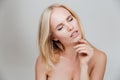 Sensual nude blonde girl with closed eyes posing Royalty Free Stock Photo