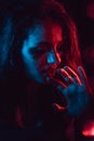 Sensual portrait of sad crying girl behind glass with raindrops Royalty Free Stock Photo