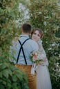 Sensual portrait of a young couple. Wedding photo outdoor. Wedding shot of bride and groom in park. Just married couple Royalty Free Stock Photo