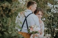 Sensual portrait of a young couple. Wedding photo outdoor. Wedding shot of bride and groom in park. Just married couple Royalty Free Stock Photo