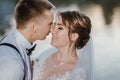 Sensual portrait of a young couple. Wedding photo outdoor. Wedding shot of bride and groom in park. Just married couple Royalty Free Stock Photo