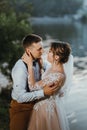 Sensual portrait of a young couple. Wedding photo outdoor. Wedding shot of bride and groom in park. Just married couple Royalty Free Stock Photo