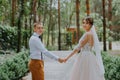 Sensual portrait of a young couple. Wedding photo outdoor. Wedding shot of bride and groom in park. Just married couple Royalty Free Stock Photo