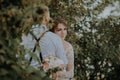 Sensual portrait of a young couple. Wedding photo outdoor. Wedding shot of bride and groom in park. Just married couple Royalty Free Stock Photo