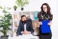 Sensual but professional. Sensual business lady. Sensual woman standing in front of businessmen in office. Adorable girl