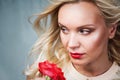 Sensual tender young woman portrait with breeze hair and red lip