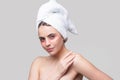 Sensual woman applying eye patches. Close up portrait girl with towel on head. Eyes mask cosmetic patches woman face