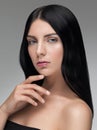 Sensual woman with black shiny hair and green eyes. Royalty Free Stock Photo