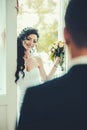 Sensual woman with bridal makeup and hairstyle. Happy bride smile to groom. Woman and man on wedding day. Fashion girl Royalty Free Stock Photo