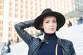 Sensual woman with brunette hair, hairstyle. Woman in black hat pose on stairs in paris, france, fashion. Beauty, look, makeup. Fa Royalty Free Stock Photo