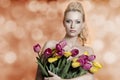 Sensual woman with colourful tulips Royalty Free Stock Photo