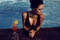 Sensual woman with dark hair in elegant black swimsuit Royalty Free Stock Photo
