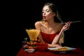 Sensual woman eat spaghetti. Healthy food concept. Hunger and appetite. Surprised girl with spaghetti noodles. Long