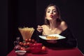 Sensual woman eat spaghetti. Italian girl eats spaghetti pasta.