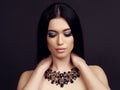 Sensual woman with long dark hair with luxurious bijou necklace Royalty Free Stock Photo