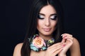 Sensual woman with straight black hair with bright makeup and flower's necklace Royalty Free Stock Photo