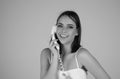 Sensual woman talking on retro line phone, phone handset. Portrait of woman holding vintage telephone. Pin up girl with Royalty Free Stock Photo