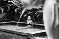 Sensual young woman relaxing in outdoor spa infinity swimming pool surrounded with lush tropical greenery of Ubud, Bali