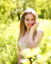 Sensual young woman, smiles sweetly in the flowered garden Royalty Free Stock Photo