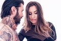 Sensual young woman touching a tattooed man Royalty Free Stock Photo