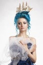 Sensual young girl with naked shoulders and painted blue hair st