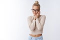 Sensuality, beauty and love concept. Tender and gentle young attractive blond woman in glasses touching cheek soft and Royalty Free Stock Photo