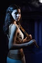 Sensuality brunette with a wooden flute