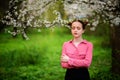 Sensuality. Happy beautiful young woman relaxing in blossom park