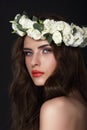 Sensuality. Young Brunette wearing Wreath of Roses