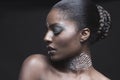 Sensuous African American woman with eyes closed over black background Royalty Free Stock Photo