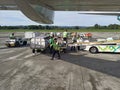 Sentani, Jayapura, Indonesia - March 17, 2023 : crowded loading and unloading process at Sentani airport by porters Royalty Free Stock Photo