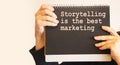 Sentence Storytelling is the best Marketing, black notebook. Motivation quote Royalty Free Stock Photo