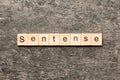 Sentence word written on wood block. Sentence text on table, concept Royalty Free Stock Photo