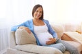 Sentimental pregnant woman at home